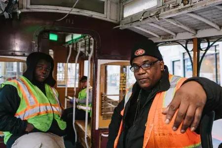 Ellis Cato and his son on a cable car.